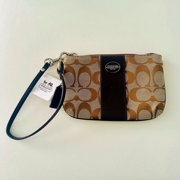 Coach Signature canvas wristlet with leather trim. - Picture 1 of 6